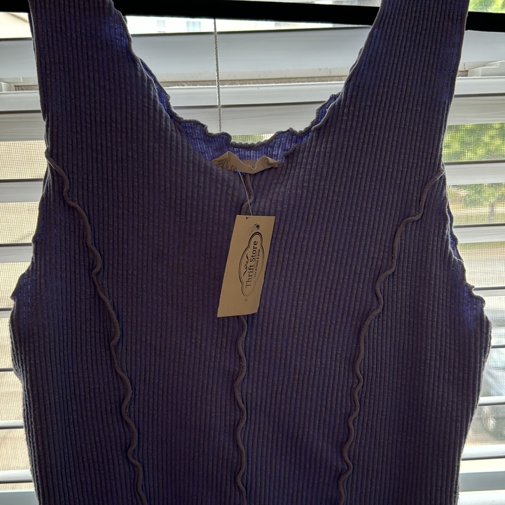 Large purple ruffle tank.